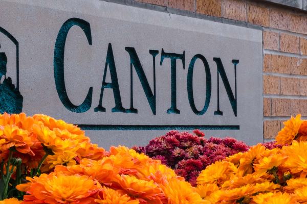 Canton, MI sign with orange flowers